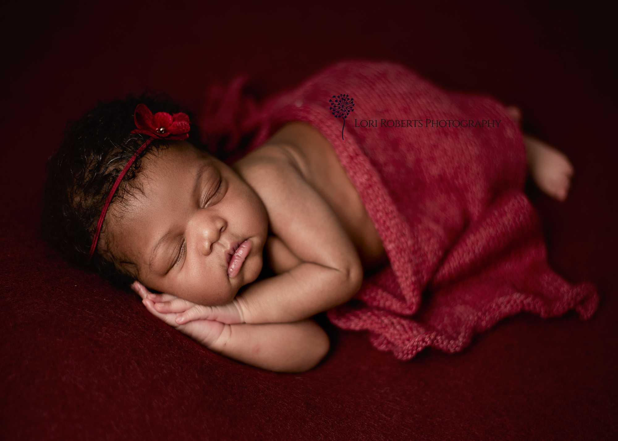 newborn on red